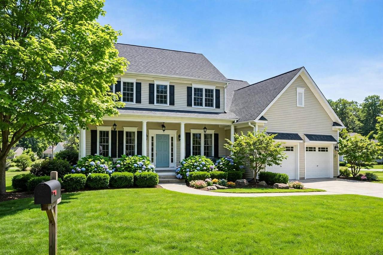 Bright suburban house with a clean green lawn on a sunny day